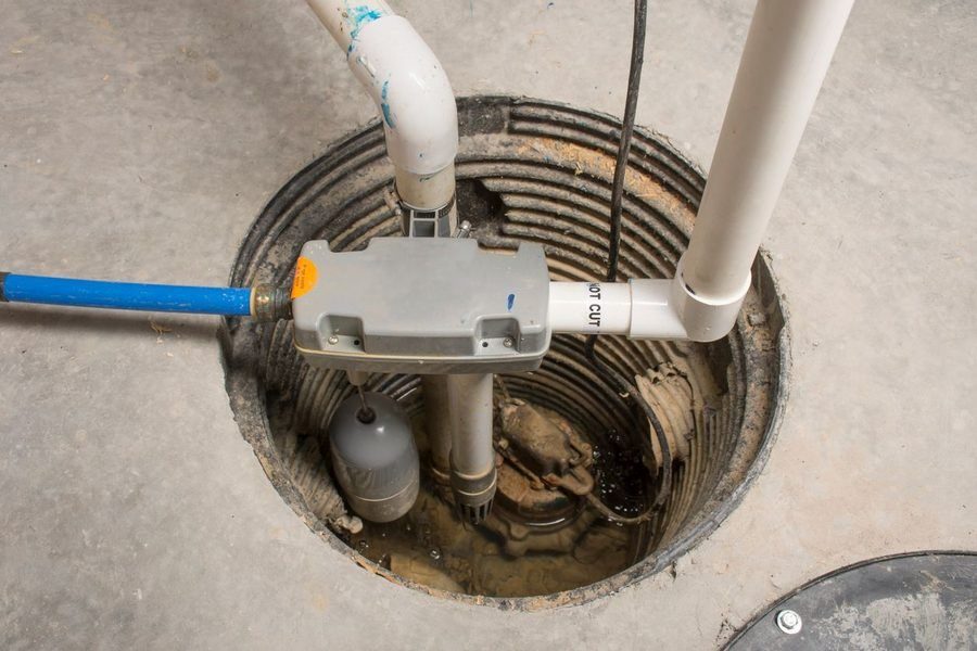 Sump pump installed in a local homeowner's basement by a professional plumber